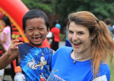 A woman and child smiling for the camera.