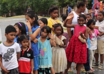 A group of children standing next to each other.