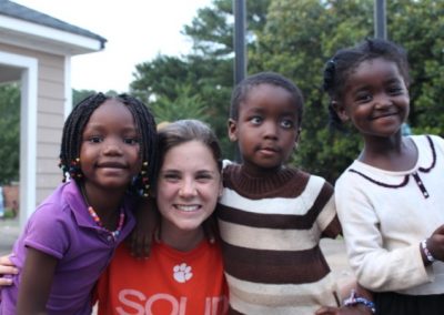 A group of young children standing next to each other.