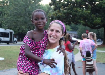 A woman and child are smiling for the camera.