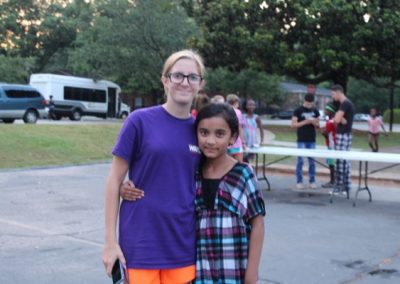 A woman and girl posing for the camera.