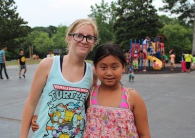 A woman and girl posing for the camera.