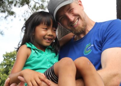 A man and girl sitting next to each other.